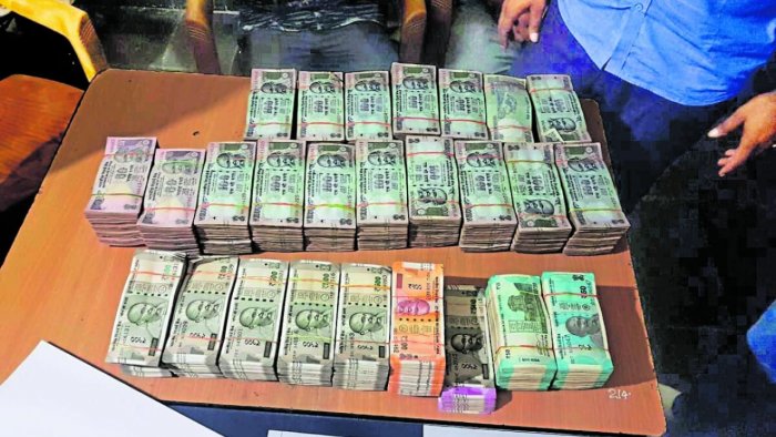 Cash seized. Credit: Special Arrangement Cash seized. Credit: Special Arrangement