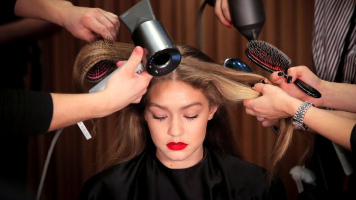 Model Gigi Hadid is prepared backstage before the Brandon Maxwell Fall/Winter 2018 collection presentation at New York Fashion Week in Manhattan, New York, US, February 11, 2018. Credit: Reuters File Photo Model Gigi Hadid is prepared backstage before the Brandon Maxwell Fall/Winter 2018 collection presentation at New York Fashion Week in Manhattan, New York, US, February 11, 2018. Credit: Reuters File Photo