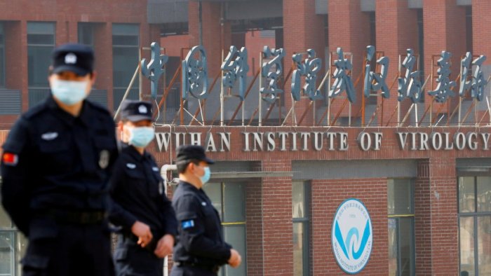 Security personnel keep watch outside the Wuhan Institute of Virology during the visit by the World Health Organization team. Credit: Reuters Photo Security personnel keep watch outside the Wuhan Institute of Virology during the visit by the World Health Organization team. Credit: Reuters Photo
